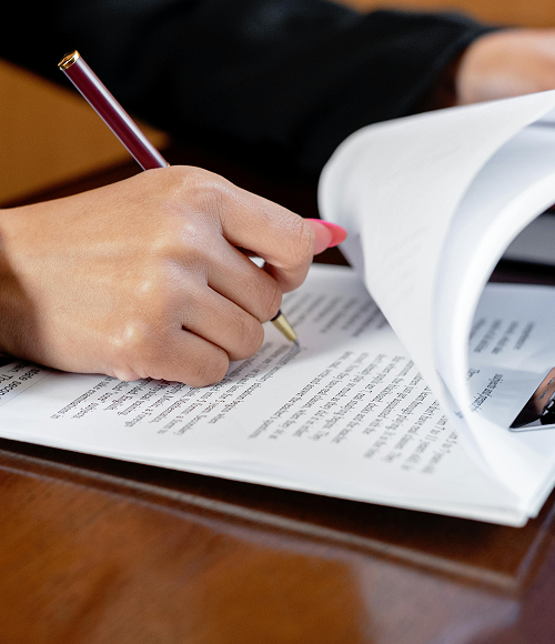 Women writing on document